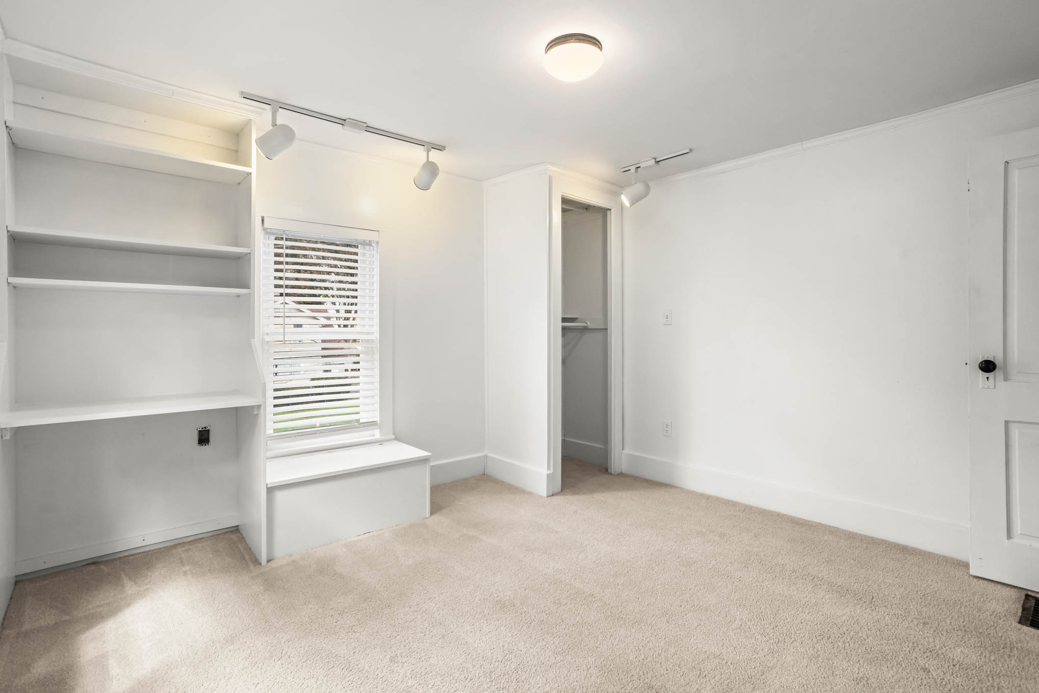 Bedroom with built-in shelving