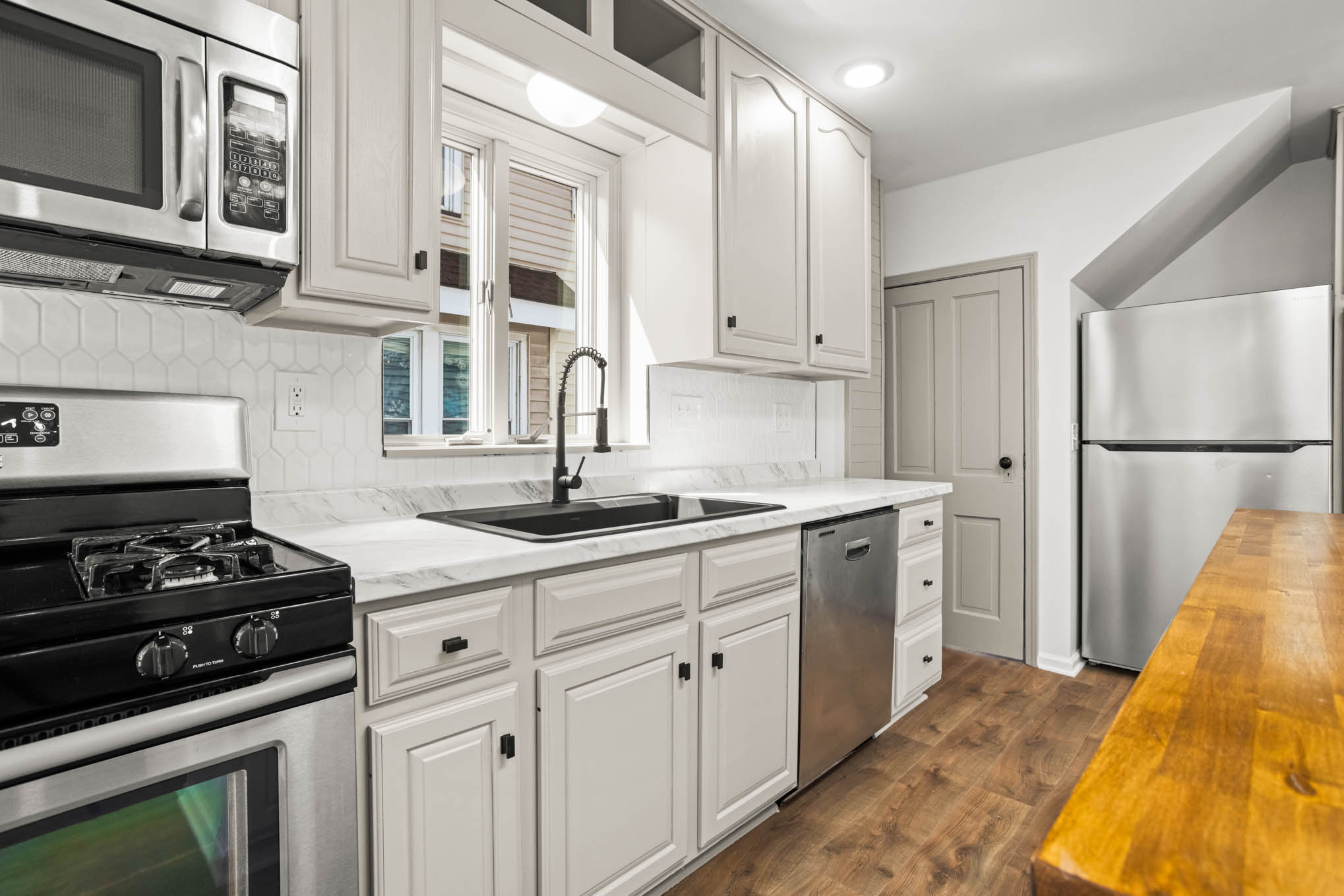 Bright kitchen with white cabinetry